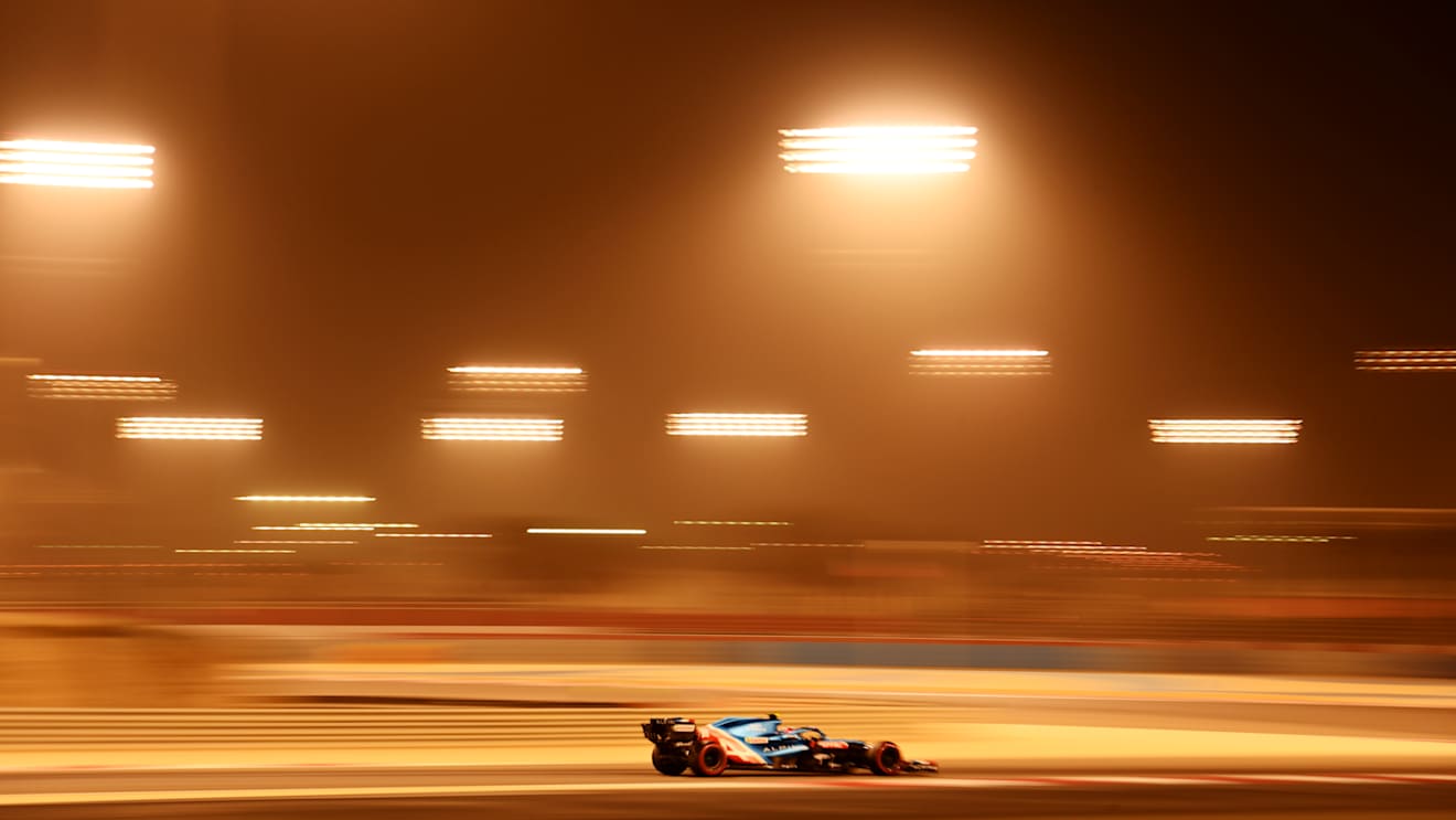 The floodlights bathe Ocon's car in a healthy glow