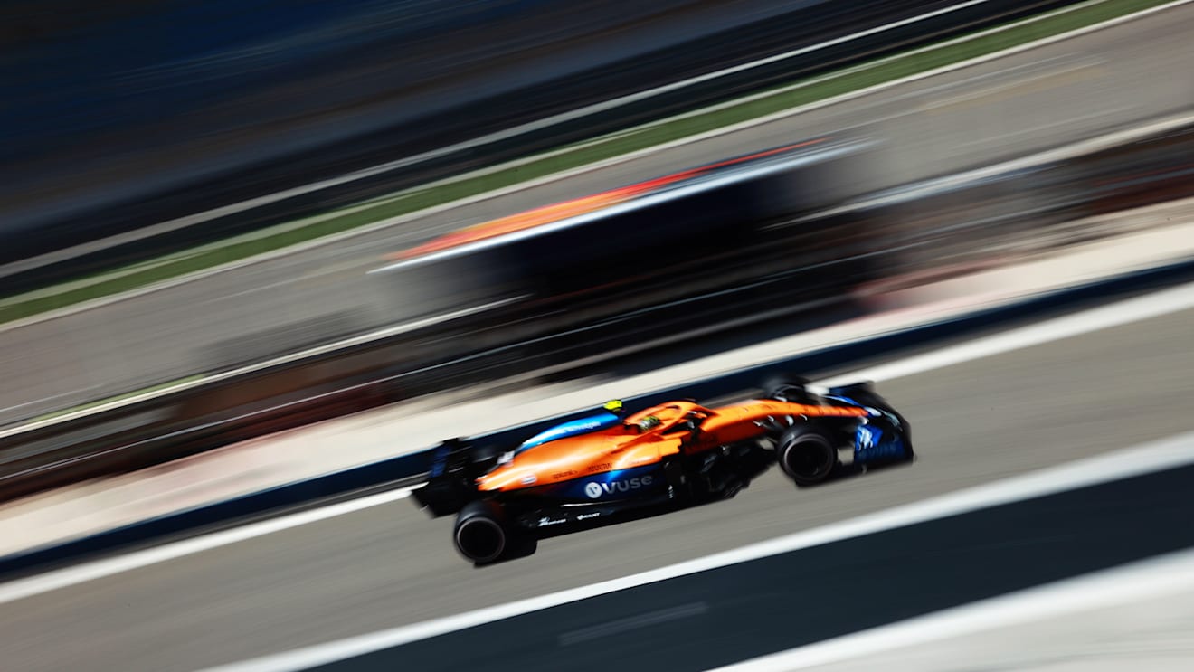 Norris flashes past in the McLaren MCL35M