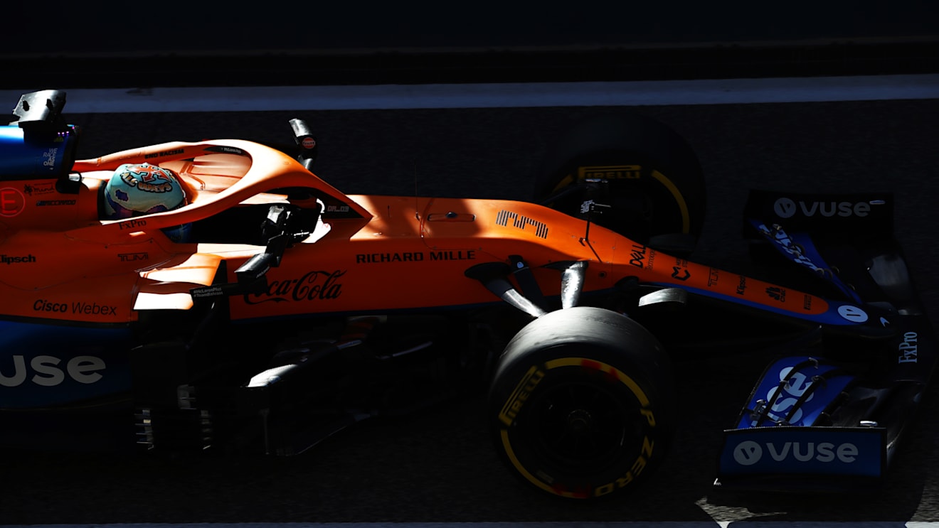 Ricciardo's MCL35M glowing in the Bahrain pitlane as he takes the wheel in the afternoon