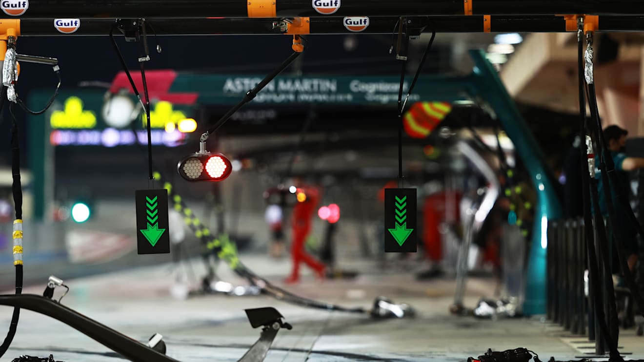 The McLaren F1 garage primed for action under the lights