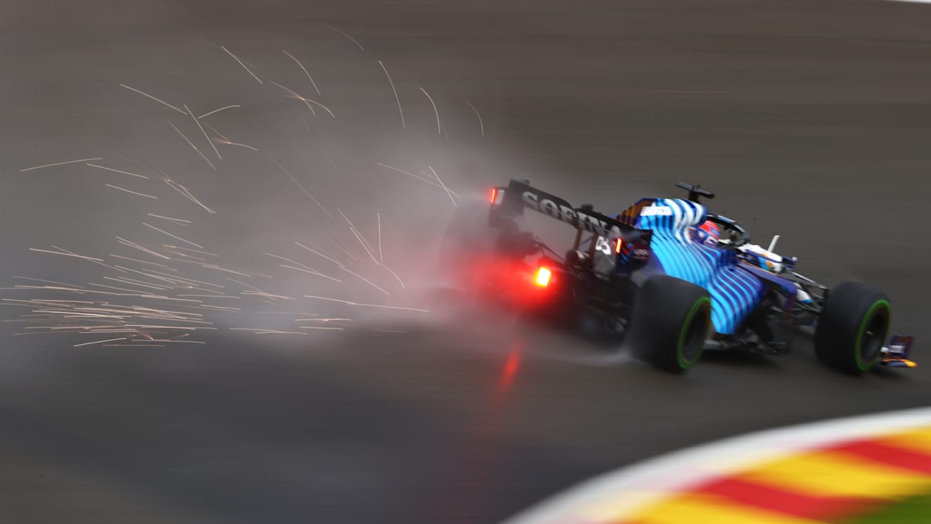 SPA, BELGIUM - AUGUST 28: Sparks fly behind George Russell of Great Britain driving the (63) Williams Racing FW43B Mercedes during qualifying ahead of the F1 Grand Prix of Belgium at Circuit de Spa-Francorchamps on August 28, 2021 in Spa, Belgium. (Photo by Dan Istitene - Formula 1/Formula 1 via Getty Images)