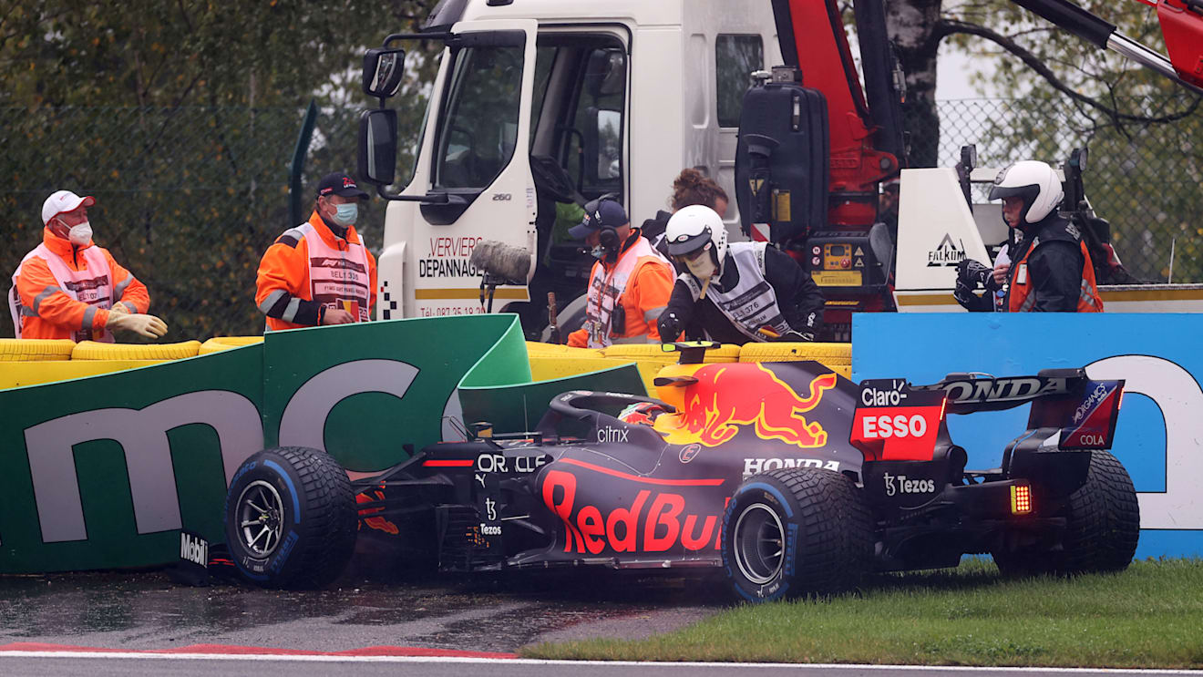 SPA, BELGIUM - AUGUST 29: Sergio Perez of Mexico driving the (11) Red Bull Racing RB16B Honda crashes on his way to the grid prior to the F1 Grand Prix of Belgium at Circuit de Spa-Francorchamps on August 29, 2021 in Spa, Belgium. (Photo by Lars Baron/Getty Images)