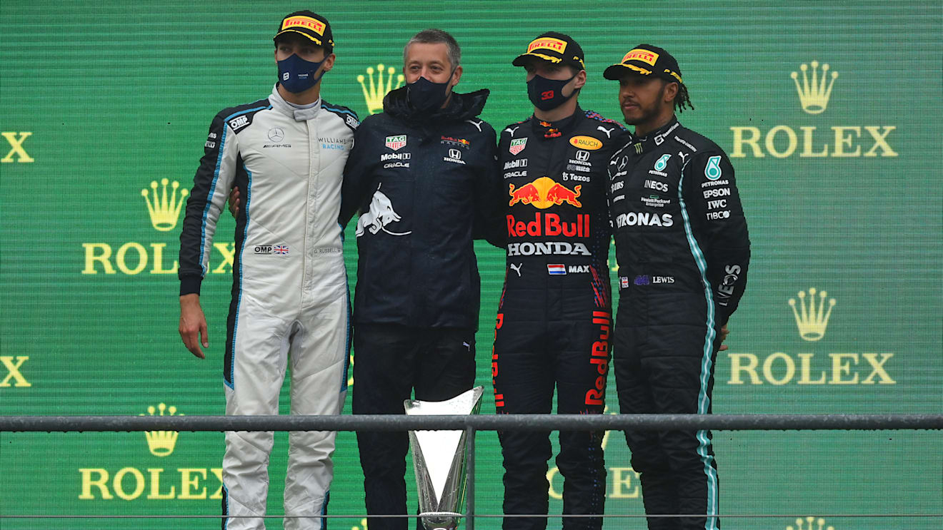 SPA, BELGIUM - AUGUST 29: Race winner Max Verstappen of Netherlands and Red Bull Racing, second placed George Russell of Great Britain and Williams and third placed Lewis Hamilton of Great Britain and Mercedes GP celebrate on the podium during the F1 Grand Prix of Belgium at Circuit de Spa-Francorchamps on August 29, 2021 in Spa, Belgium. (Photo by Dan Mullan/Getty Images)