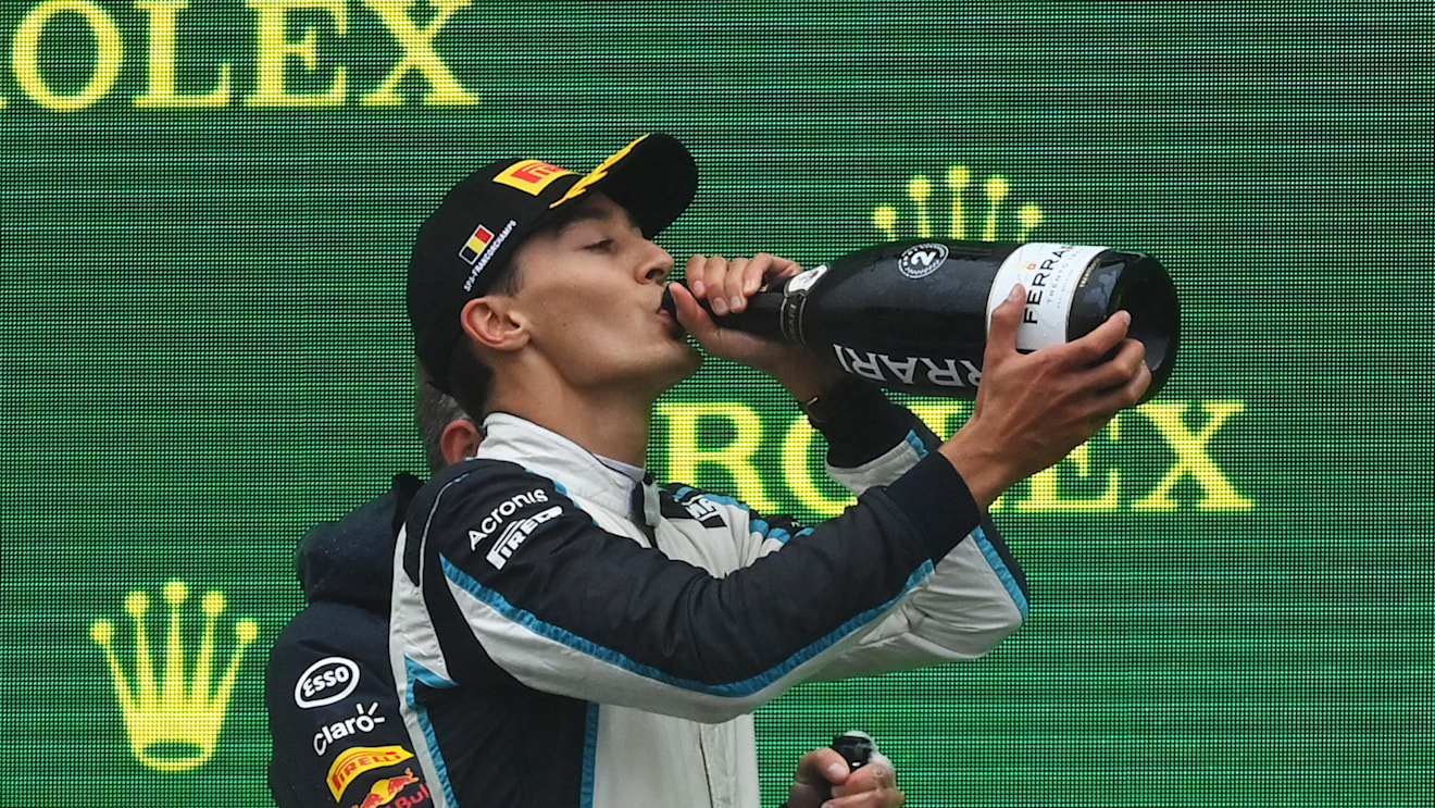 SPA, BELGIUM - AUGUST 29: Second placed George Russell of Great Britain and Williams celebrates on the podium during the F1 Grand Prix of Belgium at Circuit de Spa-Francorchamps on August 29, 2021 in Spa, Belgium. (Photo by Dan Mullan/Getty Images)