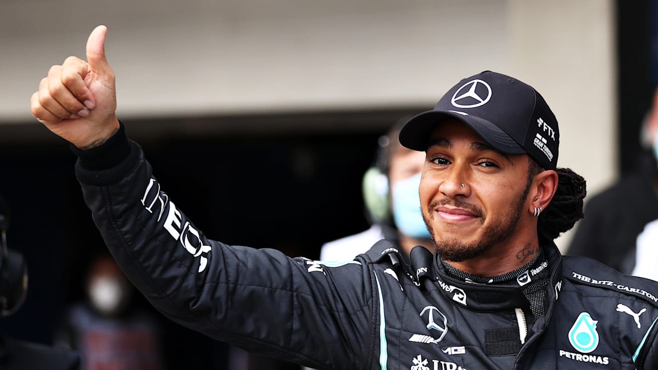 SAO PAULO, BRAZIL - NOVEMBER 12: Fastest qualifier Lewis Hamilton of Great Britain and Mercedes GP celebrates in parc ferme during qualifying ahead of the F1 Grand Prix of Brazil at Autodromo Jose Carlos Pace on November 12, 2021 in Sao Paulo, Brazil. (Photo by Lars Baron/Getty Images)