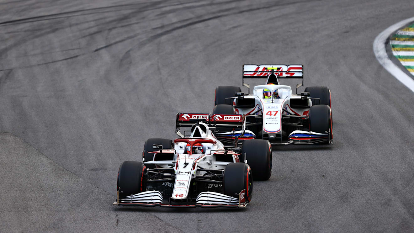 SAO PAULO, BRAZIL - NOVEMBER 13: Kimi Raikkonen of Finland driving the (7) Alfa Romeo Racing C41 Ferrari leads Mick Schumacher of Germany driving the (47) Haas F1 Team VF-21 Ferrari during the sprint ahead of the F1 Grand Prix of Brazil at Autodromo Jose Carlos Pace on November 13, 2021 in Sao Paulo, Brazil. (Photo by Bryn Lennon - Formula 1/Formula 1 via Getty Images)