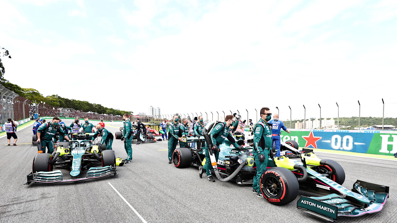 SAO PAULO, BRAZIL - NOVEMBER 13: Lance Stroll of Canada and Aston Martin F1 Team and Sebastian Vettel of Germany and Aston Martin F1 Team take their positions on the grid prior to the sprint ahead of the F1 Grand Prix of Brazil at Autodromo Jose Carlos Pace on November 13, 2021 in Sao Paulo, Brazil. (Photo by Mark Thompson/Getty Images)