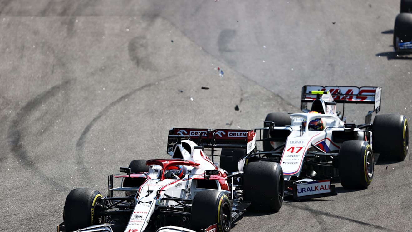 SAO PAULO, BRAZIL - NOVEMBER 14: Mick Schumacher of Germany driving the (47) Haas F1 Team VF-21 Ferrari collides with Kimi Raikkonen of Finland driving the (7) Alfa Romeo Racing C41 Ferrari during the F1 Grand Prix of Brazil at Autodromo Jose Carlos Pace on November 14, 2021 in Sao Paulo, Brazil. (Photo by Bryn Lennon - Formula 1/Formula 1 via Getty Images)