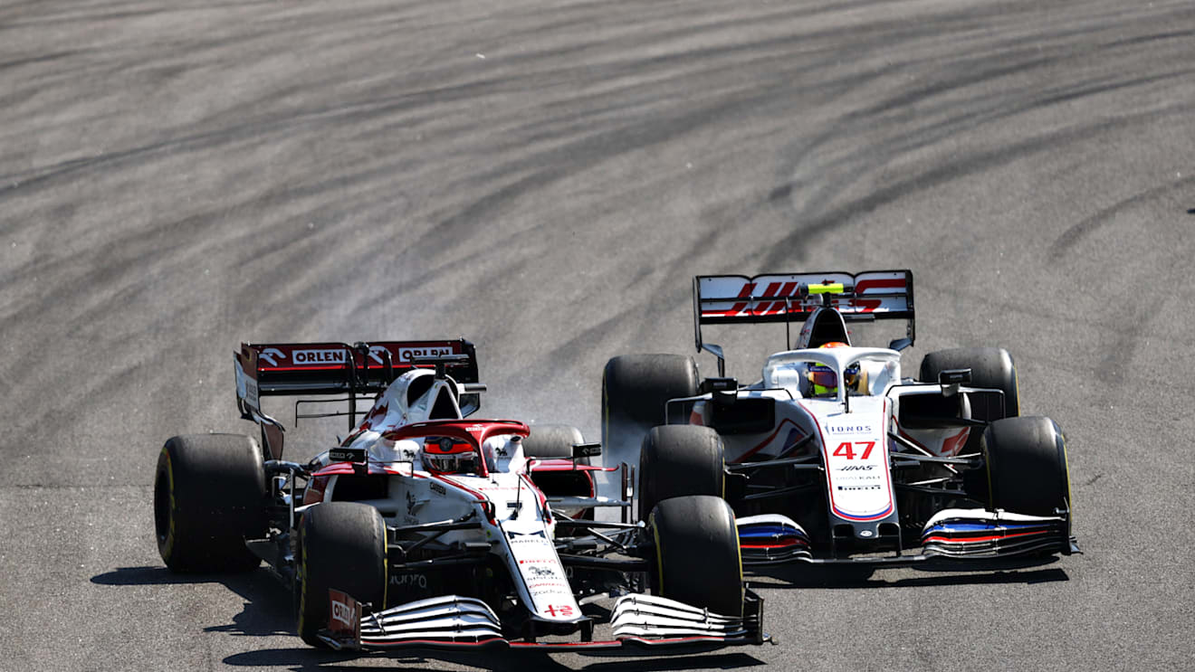 SAO PAULO, BRAZIL - NOVEMBER 14: Mick Schumacher of Germany driving the (47) Haas F1 Team VF-21 Ferrari collides with Kimi Raikkonen of Finland driving the (7) Alfa Romeo Racing C41 Ferrari during the F1 Grand Prix of Brazil at Autodromo Jose Carlos Pace on November 14, 2021 in Sao Paulo, Brazil. (Photo by Bryn Lennon - Formula 1/Formula 1 via Getty Images)