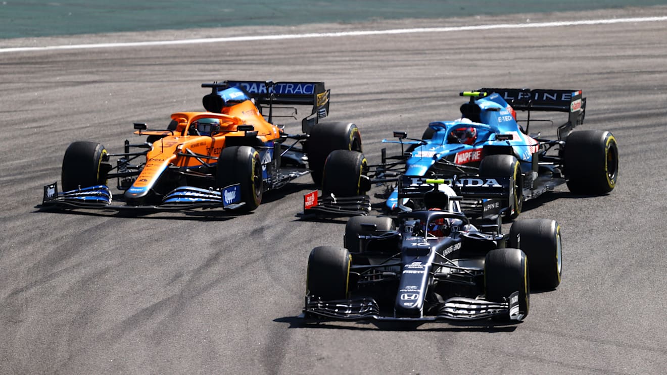 SAO PAULO, BRAZIL - NOVEMBER 14: Pierre Gasly of France driving the (10) Scuderia AlphaTauri AT02 Honda leads Daniel Ricciardo of Australia driving the (3) McLaren F1 Team MCL35M Mercedes and Esteban Ocon of France driving the (31) Alpine A521 Renault during the F1 Grand Prix of Brazil at Autodromo Jose Carlos Pace on November 14, 2021 in Sao Paulo, Brazil. (Photo by Bryn Lennon - Formula 1/Formula 1 via Getty Images)