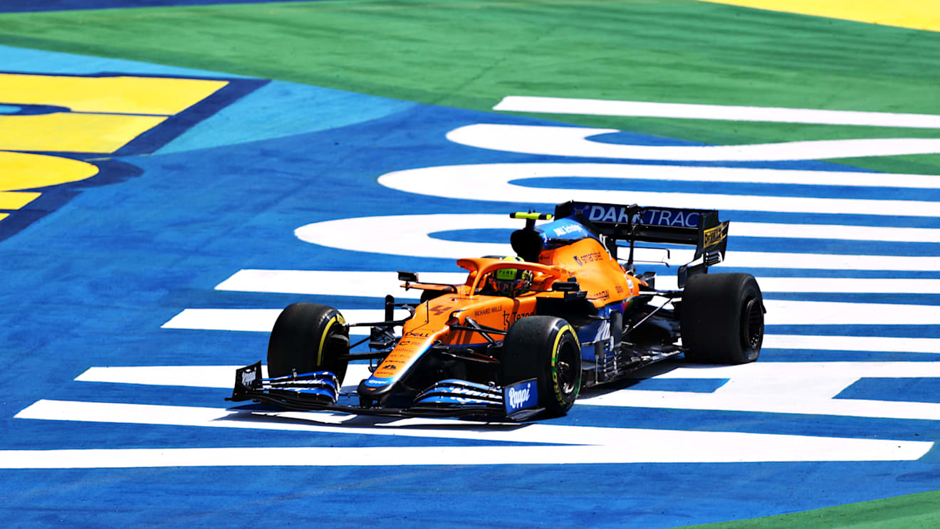 SAO PAULO, BRAZIL - NOVEMBER 14: Lando Norris of Great Britain driving the (4) McLaren F1 Team MCL35M Mercedes runs wide during the F1 Grand Prix of Brazil at Autodromo Jose Carlos Pace on November 14, 2021 in Sao Paulo, Brazil. (Photo by Bryn Lennon - Formula 1/Formula 1 via Getty Images)