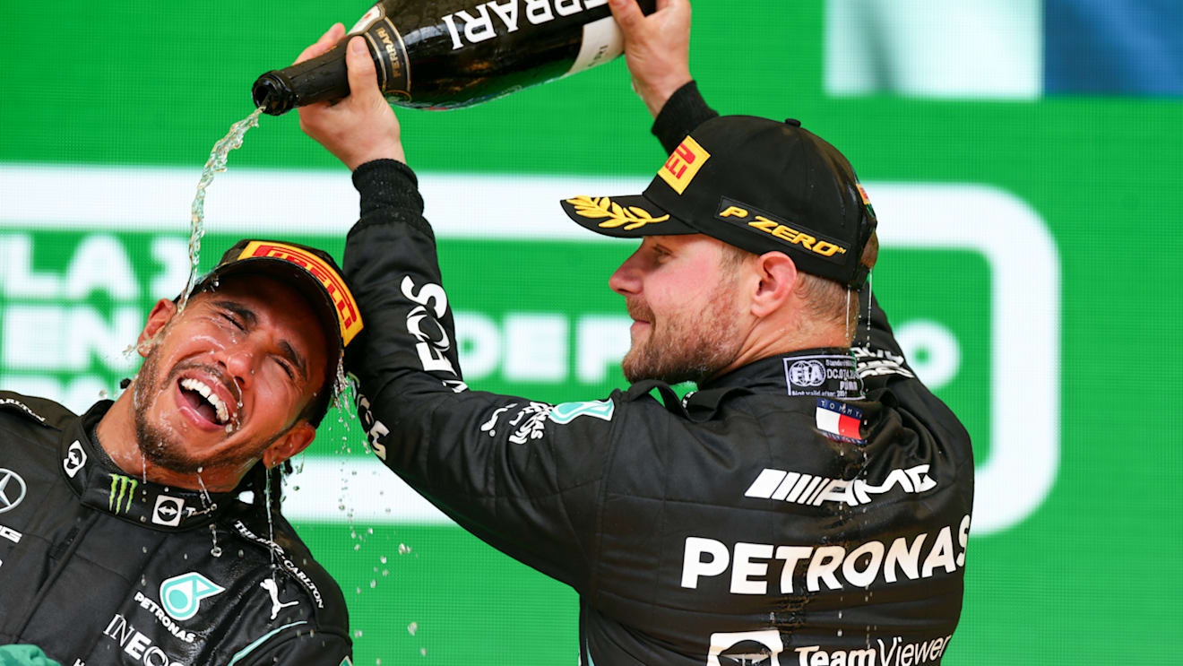 SAO PAULO, BRAZIL - NOVEMBER 14: Lewis Hamilton of Mercedes and Great Britain and Valterri Bottas of Mercedes and Finland celebrate finishing in first and third positions during the F1 Grand Prix of Brazil at Autodromo Jose Carlos Pace on November 14, 2021 in Sao Paulo, Brazil. (Photo by Peter Fox/Getty Images)