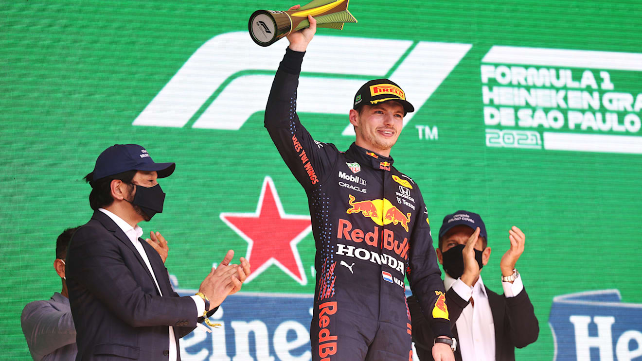 SAO PAULO, BRAZIL - NOVEMBER 14: Second placed Max Verstappen of Netherlands and Red Bull Racing celebrates on the podium during the F1 Grand Prix of Brazil at Autodromo Jose Carlos Pace on November 14, 2021 in Sao Paulo, Brazil. (Photo by Lars Baron/Getty Images)