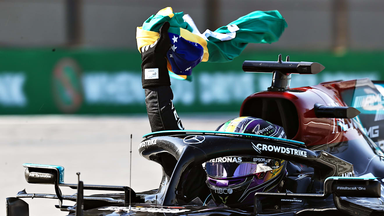 SAO PAULO, BRAZIL - NOVEMBER 14: Race winner Lewis Hamilton of Great Britain and Mercedes GP celebrates as he arrives into parc ferme during the F1 Grand Prix of Brazil at Autodromo Jose Carlos Pace on November 14, 2021 in Sao Paulo, Brazil. (Photo by Buda Mendes/Getty Images)