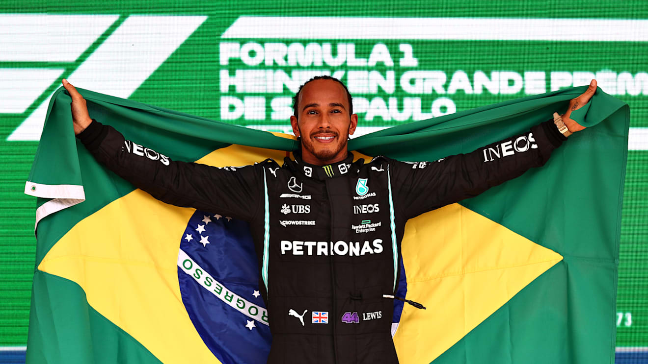 SAO PAULO, BRAZIL - NOVEMBER 14: Race winner Lewis Hamilton of Great Britain and Mercedes GP celebrates on the podium during the F1 Grand Prix of Brazil at Autodromo Jose Carlos Pace on November 14, 2021 in Sao Paulo, Brazil. (Photo by Mark Thompson/Getty Images)