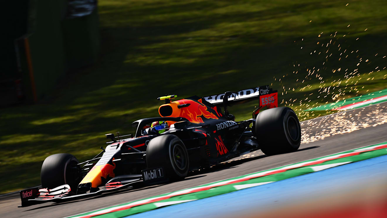 IMOLA, ITALY - APRIL 16: Sparks fly behind Sergio Perez of Mexico driving the (11) Red Bull Racing RB16B Honda during practice ahead of the F1 Grand Prix of Emilia Romagna at Autodromo Enzo e Dino Ferrari on April 16, 2021 in Imola, Italy. (Photo by Clive Mason - Formula 1/Formula 1 via Getty Images)