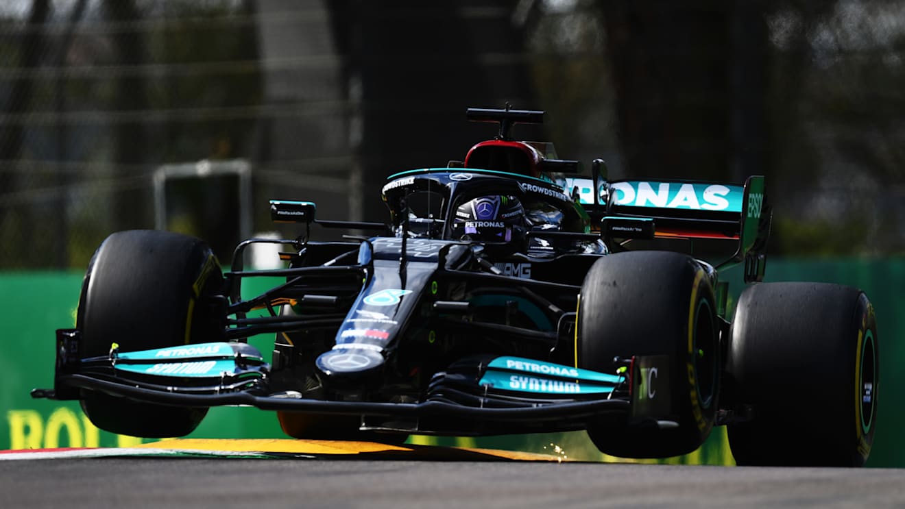 IMOLA, ITALY - APRIL 16: Lewis Hamilton of Great Britain driving the (44) Mercedes AMG Petronas F1 Team Mercedes W12 launches off a raised kerb during practice ahead of the F1 Grand Prix of Emilia Romagna at Autodromo Enzo e Dino Ferrari on April 16, 2021 in Imola, Italy. (Photo by Clive Mason - Formula 1/Formula 1 via Getty Images)