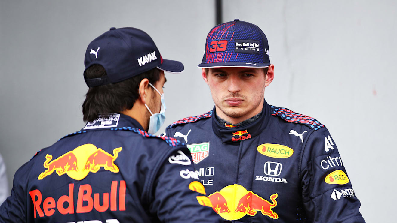 IMOLA, ITALY - APRIL 17: Second place qualifier Sergio Perez of Mexico and Red Bull Racing and third place qualifier Max Verstappen of Netherlands and Red Bull Racing talk in parc ferme during qualifying ahead of the F1 Grand Prix of Emilia Romagna at Autodromo Enzo e Dino Ferrari on April 17, 2021 in Imola, Italy. (Photo by Mark Thompson/Getty Images)