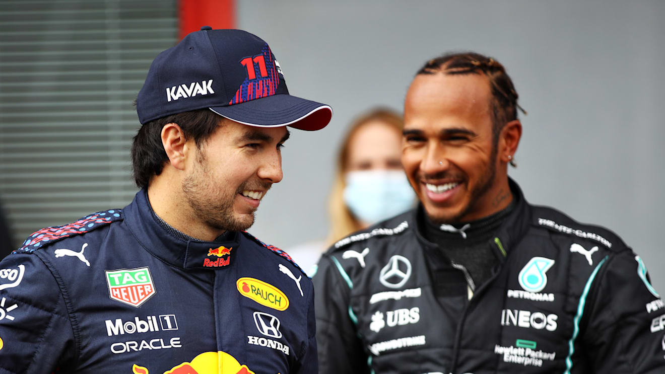 IMOLA, ITALY - APRIL 17: Second place qualifier Sergio Perez of Mexico and Red Bull Racing and pole position qualifier Lewis Hamilton of Great Britain and Mercedes GP talk in parc ferme during qualifying ahead of the F1 Grand Prix of Emilia Romagna at Autodromo Enzo e Dino Ferrari on April 17, 2021 in Imola, Italy. (Photo by Mark Thompson/Getty Images)