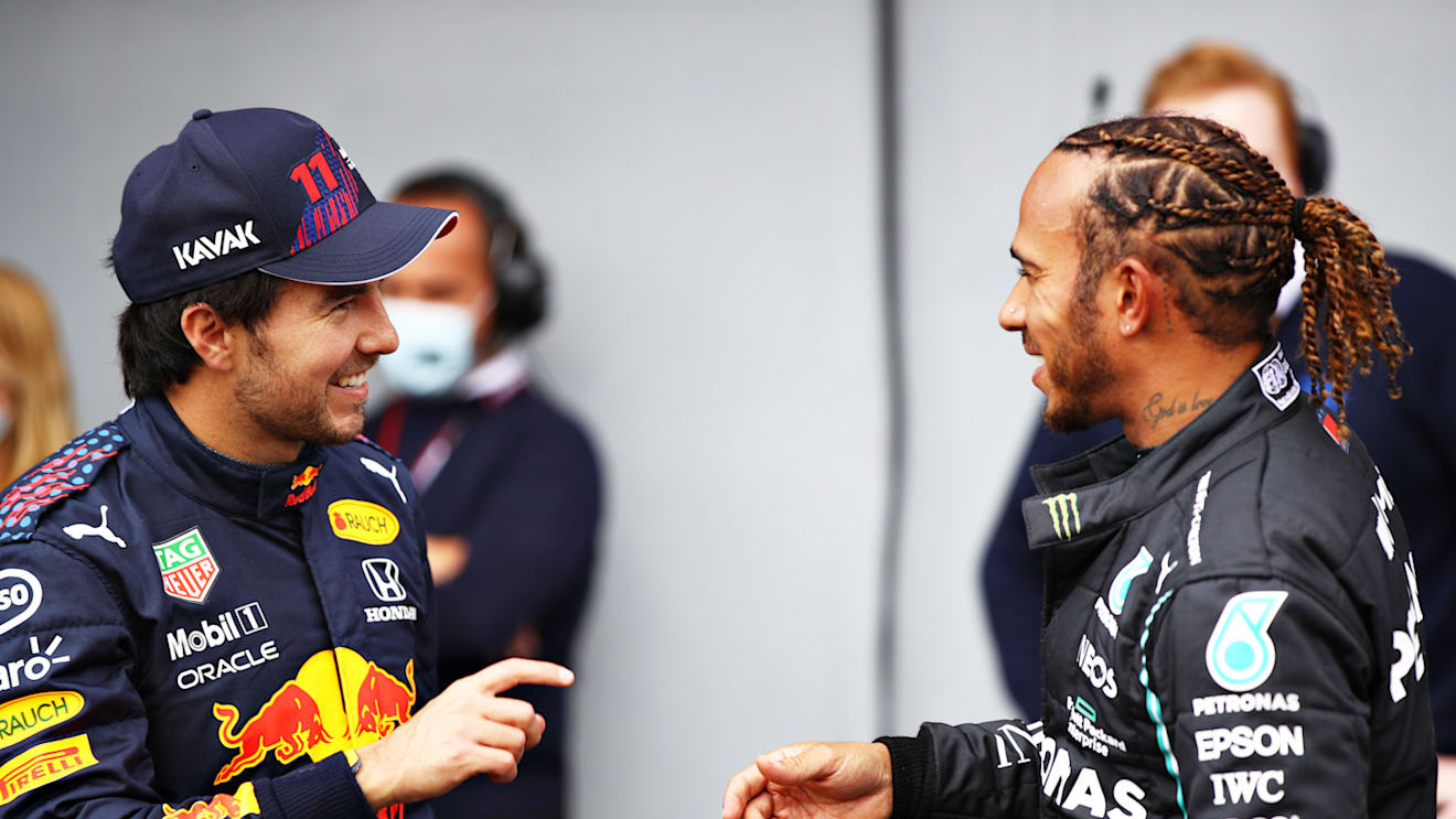 IMOLA, ITALY - APRIL 17: Second place qualifier Sergio Perez of Mexico and Red Bull Racing and pole position qualifier Lewis Hamilton of Great Britain and Mercedes GP talk in parc ferme during qualifying ahead of the F1 Grand Prix of Emilia Romagna at Autodromo Enzo e Dino Ferrari on April 17, 2021 in Imola, Italy. (Photo by Mark Thompson/Getty Images)