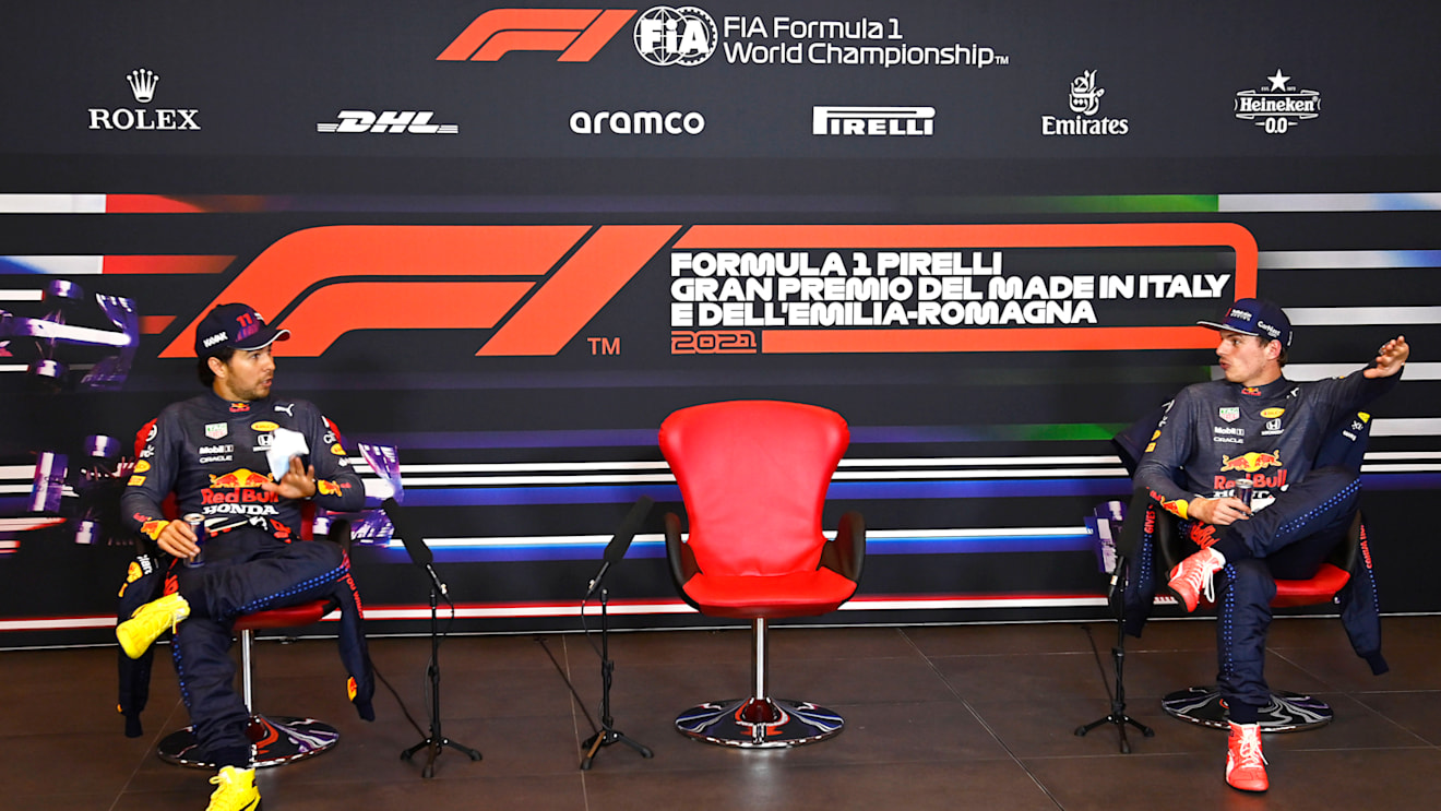 IMOLA, ITALY - APRIL 17:  Second place qualifier Sergio Perez of Mexico and Red Bull Racing and Third place qualifier Max Verstappen of Netherlands and Red Bull Racing wait for Pole position qualifier Lewis Hamilton of Great Britain and Mercedes GP during a press conference after qualifying ahead of the F1 Grand Prix of Emilia Romagna at Autodromo Enzo e Dino Ferrari on April 17, 2021 in Imola, Italy. (Photo by Mark Sutton - Pool/Getty Images)