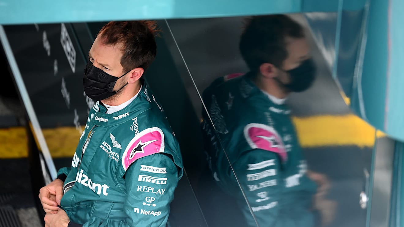 IMOLA, ITALY - APRIL 17: Sebastian Vettel of Germany and Aston Martin F1 Team looks on in the Paddock during final practice ahead of the F1 Grand Prix of Emilia Romagna at Autodromo Enzo e Dino Ferrari on April 17, 2021 in Imola, Italy. (Photo by Clive Mason - Formula 1/Formula 1 via Getty Images)