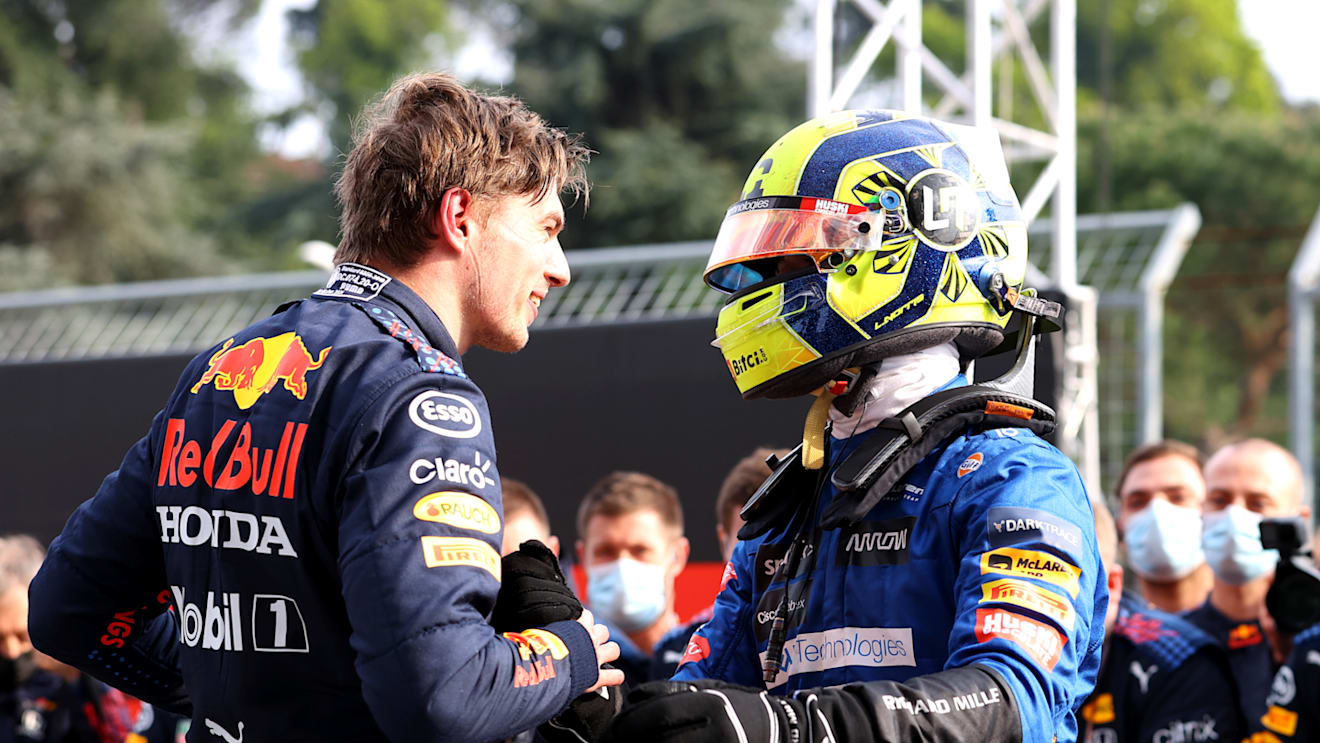 IMOLA, ITALY - APRIL 18: Race winner Max Verstappen of Netherlands and Red Bull Racing and third placed Lando Norris of Great Britain and McLaren F1 celebrate in parc ferme during the F1 Grand Prix of Emilia Romagna at Autodromo Enzo e Dino Ferrari on April 18, 2021 in Imola, Italy. (Photo by Bryn Lennon/Getty Images)