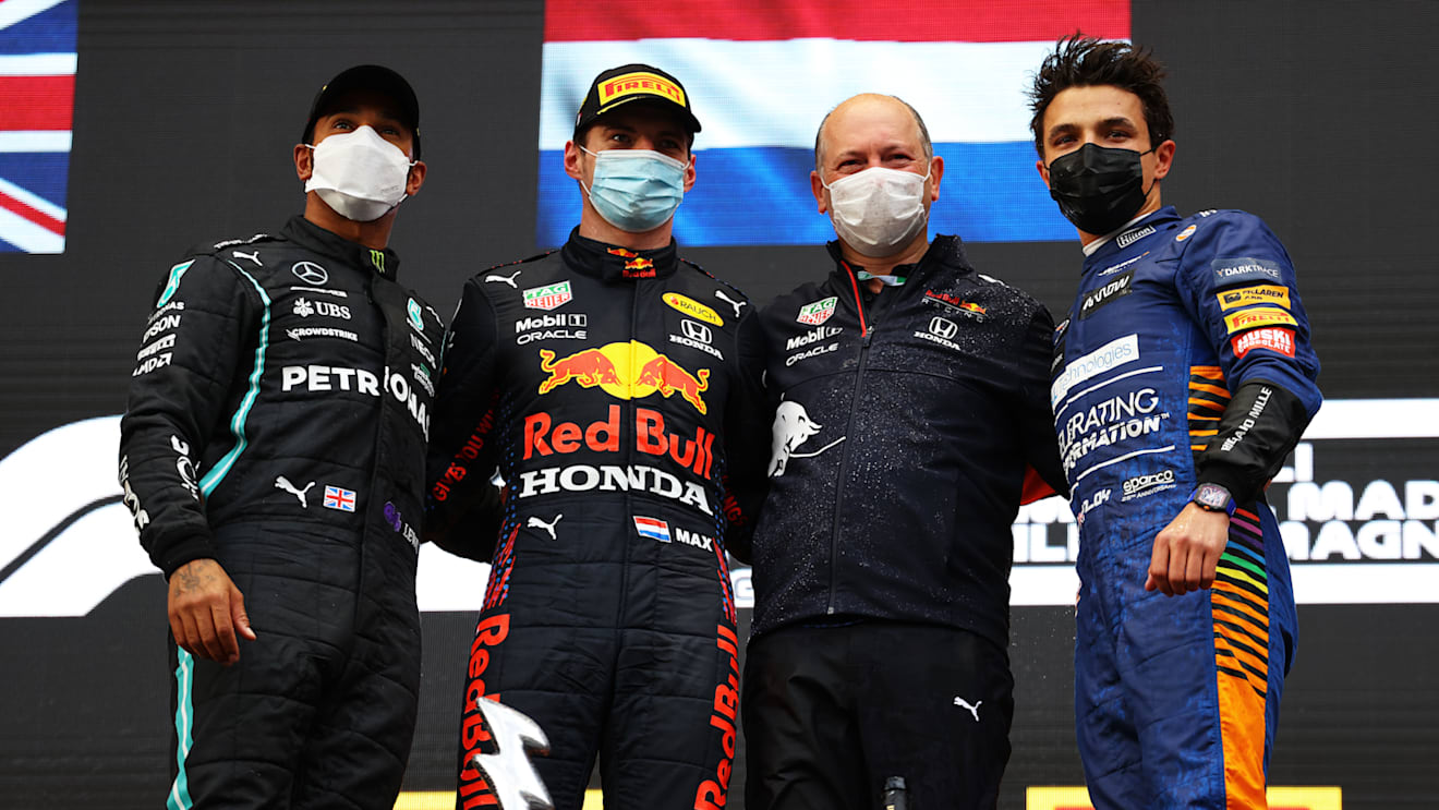 IMOLA, ITALY - APRIL 18: Second placed Lewis Hamilton of Great Britain and Mercedes GP, race winner Max Verstappen of Netherlands and Red Bull Racing, Alastair Rew, Financial Director of Red Bull Racing and third placed Lando Norris of Great Britain and McLaren F1 celebrate on the podium after the F1 Grand Prix of Emilia Romagna at Autodromo Enzo e Dino Ferrari on April 18, 2021 in Imola, Italy. (Photo by Bryn Lennon/Getty Images)