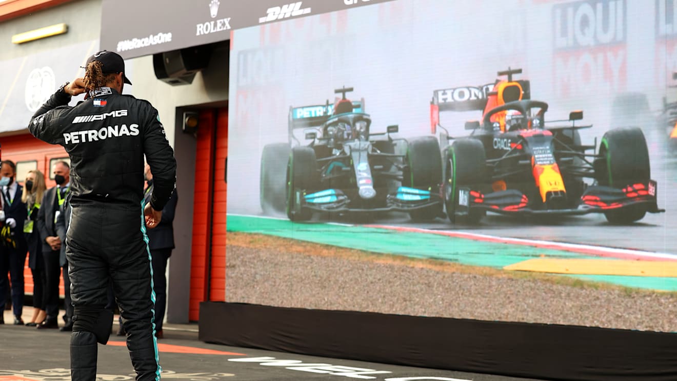 IMOLA, ITALY - APRIL 18: Second placed Lewis Hamilton of Great Britain and Mercedes GP watches a replay of the start of the race on a screen in parc ferme after the F1 Grand Prix of Emilia Romagna at Autodromo Enzo e Dino Ferrari on April 18, 2021 in Imola, Italy. (Photo by Bryn Lennon/Getty Images)