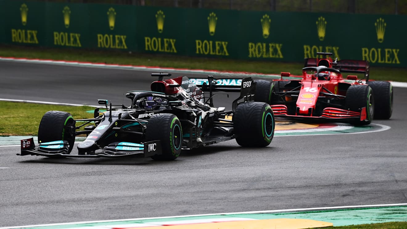 IMOLA, ITALY - APRIL 18: Lewis Hamilton of Great Britain driving the (44) Mercedes AMG Petronas F1 Team Mercedes W12 leads Charles Leclerc of Monaco driving the (16) Scuderia Ferrari SF21 on track during the F1 Grand Prix of Emilia Romagna at Autodromo Enzo e Dino Ferrari on April 18, 2021 in Imola, Italy. (Photo by Clive Mason - Formula 1/Formula 1 via Getty Images)