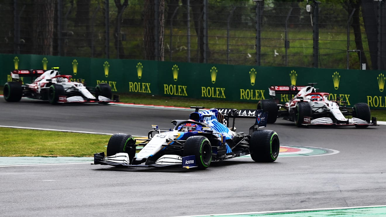 IMOLA, ITALY - APRIL 18: George Russell of Great Britain driving the (63) Williams Racing FW43B Mercedes leads Kimi Raikkonen of Finland driving the (7) Alfa Romeo Racing C41 Ferrari on track during the F1 Grand Prix of Emilia Romagna at Autodromo Enzo e Dino Ferrari on April 18, 2021 in Imola, Italy. (Photo by Clive Mason - Formula 1/Formula 1 via Getty Images)