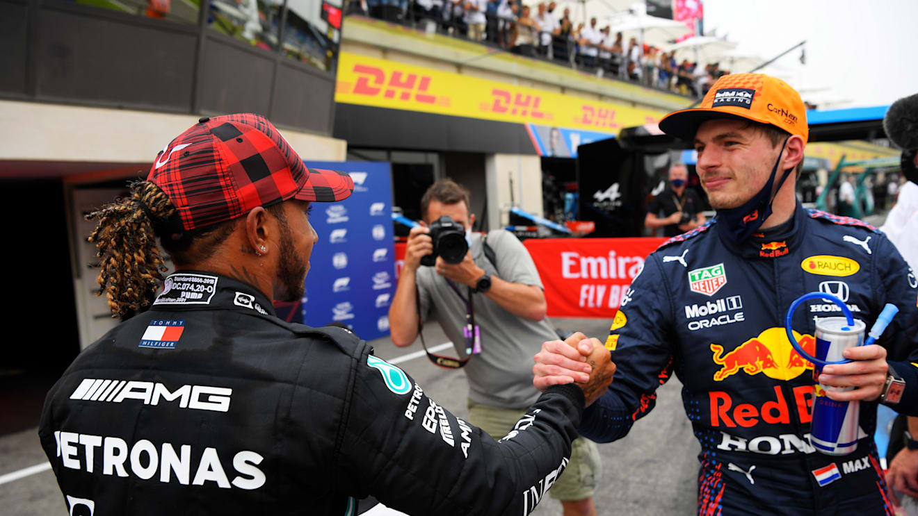 LE CASTELLET, FRANCE - JUNE 19: Pole position qualifier Max Verstappen of Netherlands and Red Bull Racing and second placed qualifier Lewis Hamilton of Great Britain and Mercedes GP interact in parc ferme during qualifying ahead of the F1 Grand Prix of France at Circuit Paul Ricard on June 19, 2021 in Le Castellet, France. (Photo by Nicolas Tucat - Pool/Getty Images)
