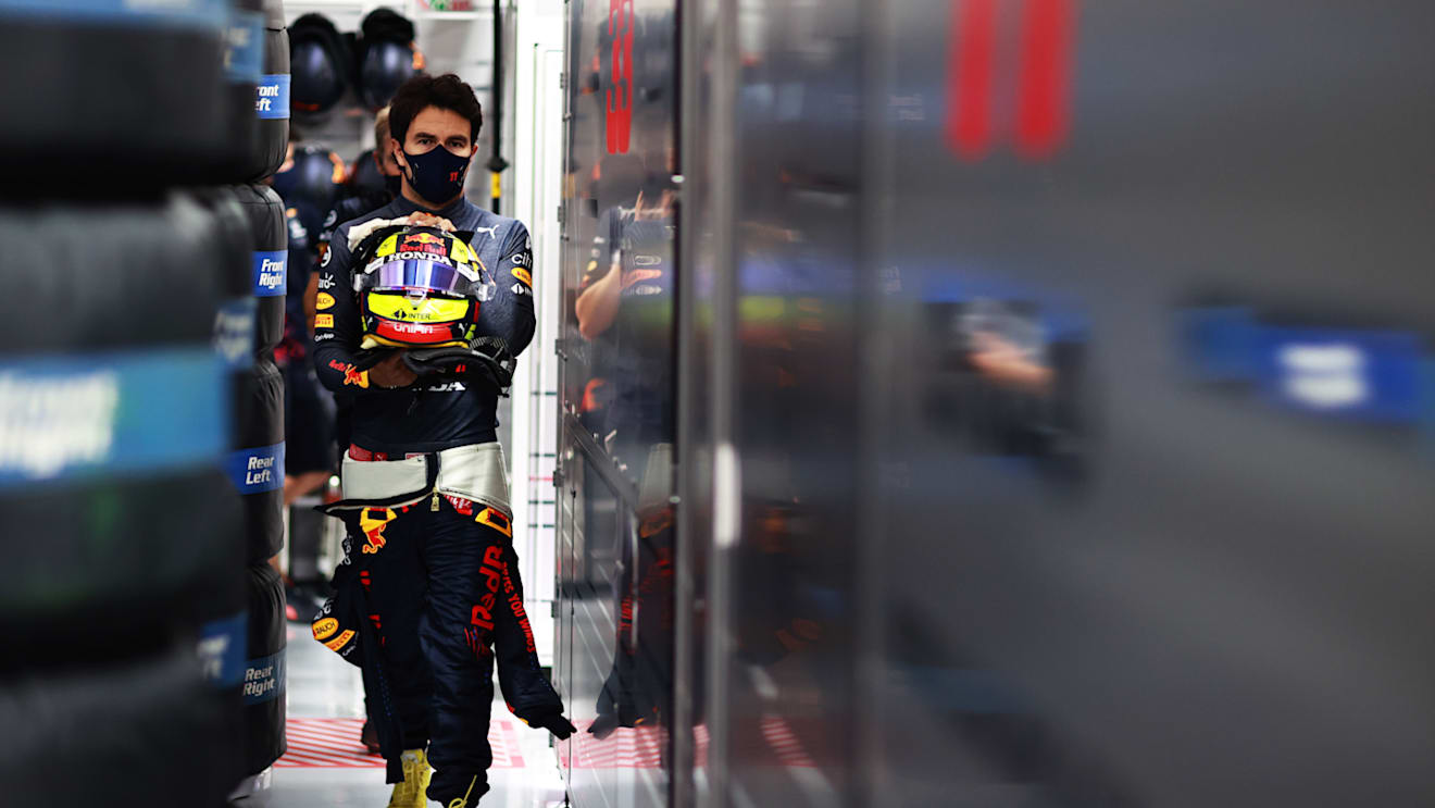 LE CASTELLET, FRANCE - JUNE 19: Sergio Perez of Mexico and Red Bull Racing walks in the garage during qualifying ahead of the F1 Grand Prix of France at Circuit Paul Ricard on June 19, 2021 in Le Castellet, France. (Photo by Mark Thompson/Getty Images)