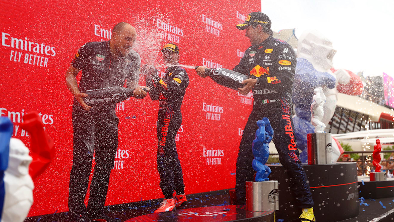 LE CASTELLET, FRANCE - JUNE 20: Red Bull Racing race engineer Gianpiero Lambiase, race winner Max Verstappen of Netherlands and Red Bull Racing and third placed Sergio Perez of Mexico and Red Bull Racing celebrate on the podium with sparkling wine during the F1 Grand Prix of France at Circuit Paul Ricard on June 20, 2021 in Le Castellet, France. (Photo by Dan Istitene - Formula 1/Formula 1 via Getty Images)