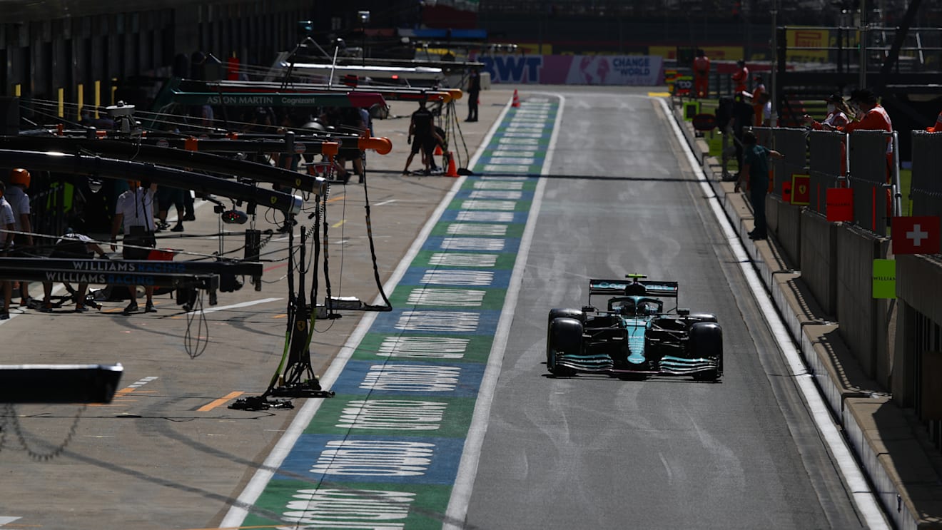 NORTHAMPTON, ENGLAND - JULY 16: Sebastian Vettel of Germany driving the (5) Aston Martin AMR21 Mercedes in the Pitlane during practice ahead of the F1 Grand Prix of Great Britain at Silverstone on July 16, 2021 in Northampton, England. (Photo by Mark Thompson/Getty Images)