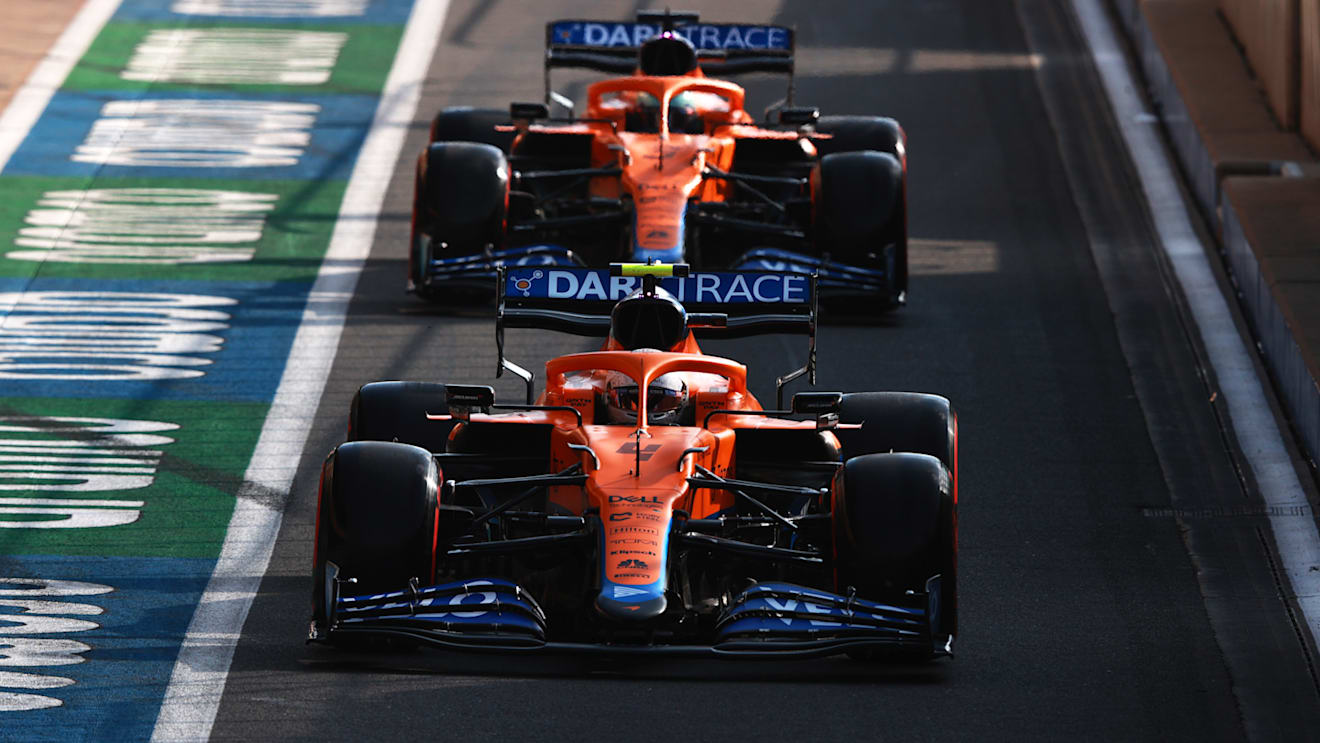 NORTHAMPTON, ENGLAND - JULY 16: Lando Norris of Great Britain driving the (4) McLaren F1 Team MCL35M Mercedes leads Daniel Ricciardo of Australia driving the (3) McLaren F1 Team MCL35M Mercedes out of the pitlane during qualifying ahead of the F1 Grand Prix of Great Britain at Silverstone on July 16, 2021 in Northampton, England. (Photo by Mark Thompson/Getty Images)