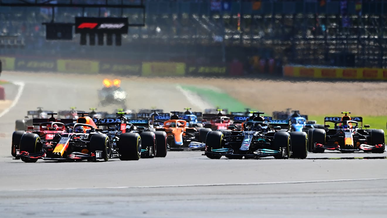 NORTHAMPTON, ENGLAND - JULY 17: Max Verstappen of the Netherlands driving the (33) Red Bull Racing RB16B Honda leads the field into turn one at the start during the Sprint for the F1 Grand Prix of Great Britain at Silverstone on July 17, 2021 in Northampton, England. (Photo by Michael Regan/Getty Images)