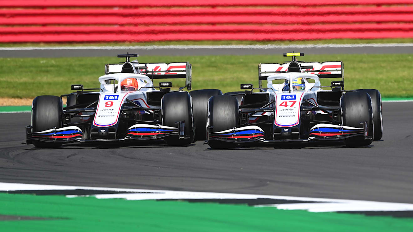 NORTHAMPTON, ENGLAND - JULY 18: Nikita Mazepin of Russia driving the (9) Haas F1 Team VF-21 Ferrari and Mick Schumacher of Germany driving the (47) Haas F1 Team VF-21 Ferrari battle for position during the F1 Grand Prix of Great Britain at Silverstone on July 18, 2021 in Northampton, England. (Photo by Michael Regan/Getty Images)
