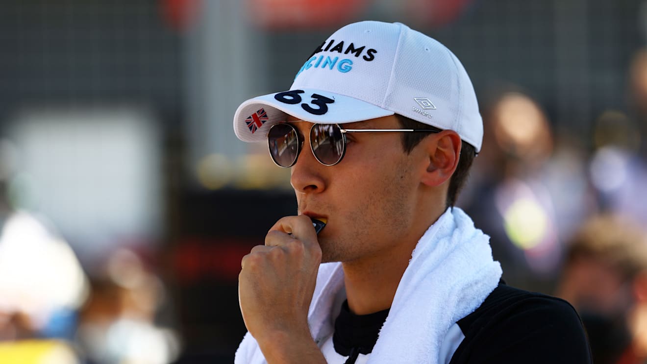 NORTHAMPTON, ENGLAND - JULY 18: George Russell of Great Britain and Williams prepares to drive on the grid  before the F1 Grand Prix of Great Britain at Silverstone on July 18, 2021 in Northampton, England. (Photo by Bryn Lennon - Formula 1/Formula 1 via Getty Images)