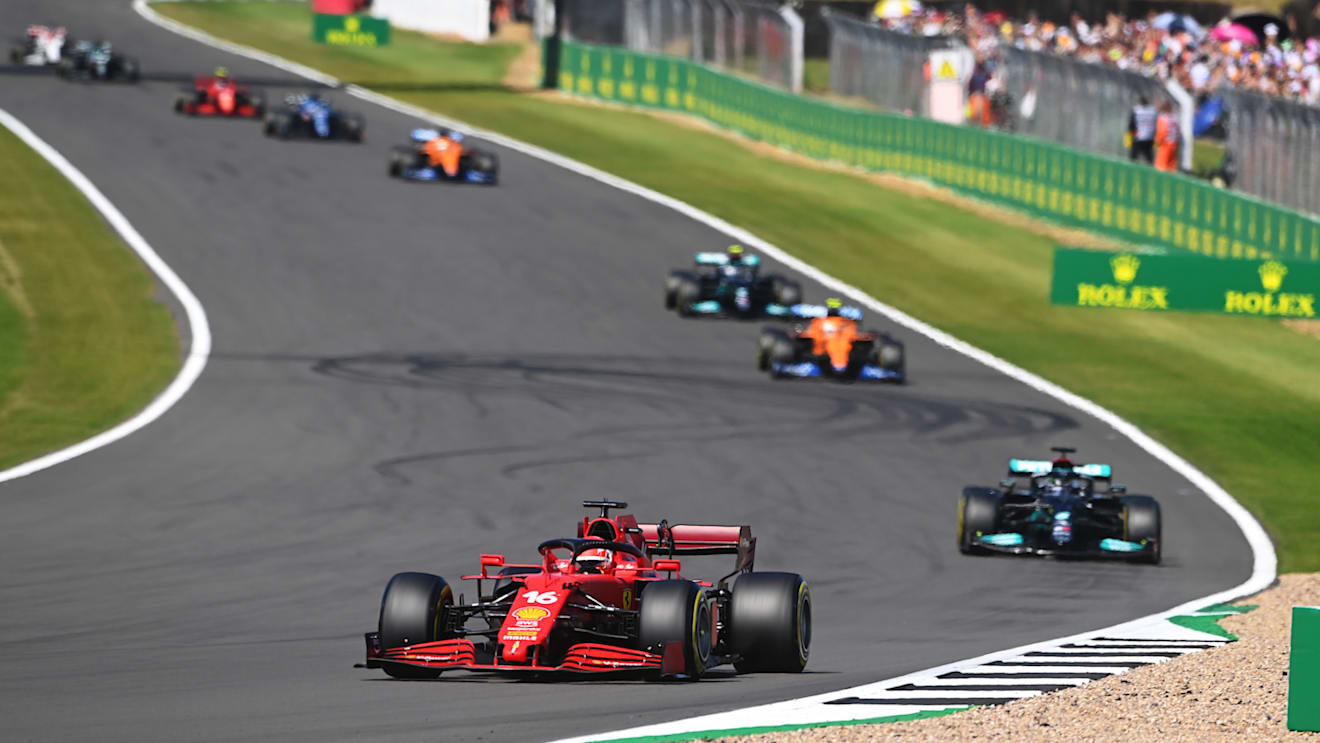 NORTHAMPTON, ENGLAND - JULY 18: Charles Leclerc of Monaco driving the (16) Scuderia Ferrari SF21 leads Lewis Hamilton of Great Britain driving the (44) Mercedes AMG Petronas F1 Team Mercedes W12 during the F1 Grand Prix of Great Britain at Silverstone on July 18, 2021 in Northampton, England. (Photo by Michael Regan/Getty Images)