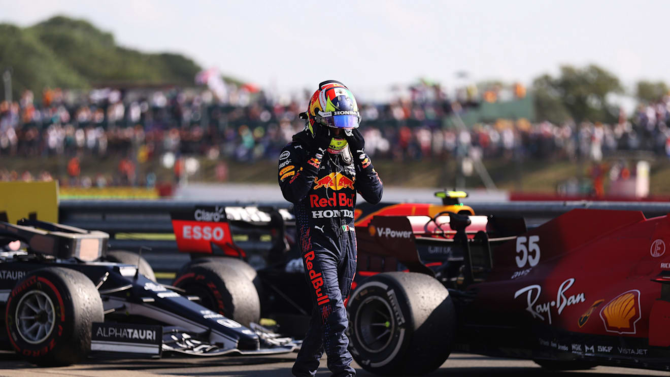 NORTHAMPTON, ENGLAND - JULY 18: Sergio Perez of Mexico and Red Bull Racing walks in parc ferme during the F1 Grand Prix of Great Britain at Silverstone on July 18, 2021 in Northampton, England. (Photo by Lars Baron/Getty Images)