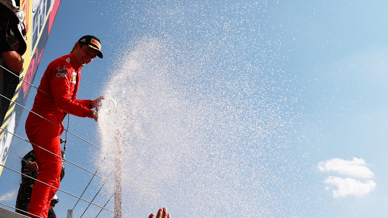 NORTHAMPTON, ENGLAND - JULY 18: Second placed Charles Leclerc of Monaco and Ferrari celebrates on the podium  during the F1 Grand Prix of Great Britain at Silverstone on July 18, 2021 in Northampton, England. (Photo by Mark Thompson/Getty Images)