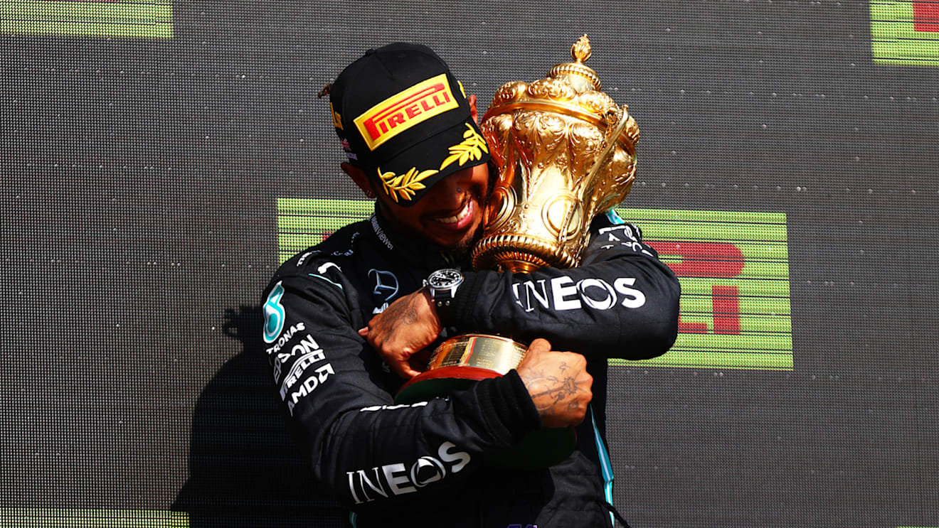 NORTHAMPTON, ENGLAND - JULY 18: Race winner Lewis Hamilton of Great Britain and Mercedes GP celebrates on the podium during the F1 Grand Prix of Great Britain at Silverstone on July 18, 2021 in Northampton, England. (Photo by Dan Istitene - Formula 1/Formula 1 via Getty Images)