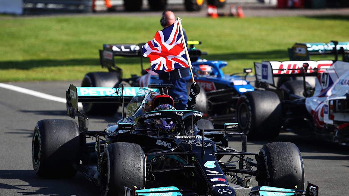 NORTHAMPTON, ENGLAND - JULY 18: Race winner Lewis Hamilton of Great Britain and Mercedes GP celebrates in parc ferme during the F1 Grand Prix of Great Britain at Silverstone on July 18, 2021 in Northampton, England. (Photo by Mark Thompson/Getty Images)