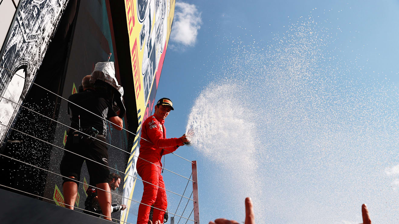 NORTHAMPTON, ENGLAND - JULY 18: Second placed Charles Leclerc of Monaco and Ferrari celebrates on the podium  during the F1 Grand Prix of Great Britain at Silverstone on July 18, 2021 in Northampton, England. (Photo by Mark Thompson/Getty Images)
