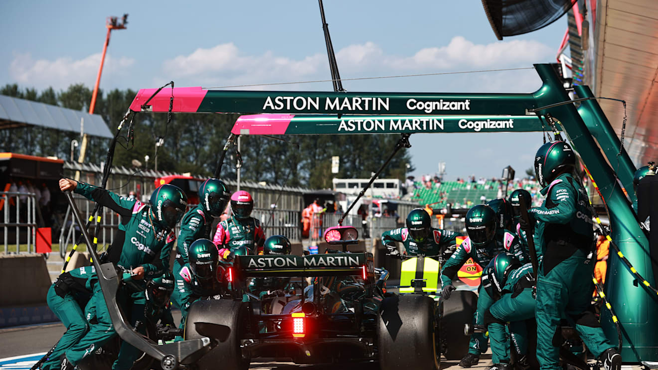 NORTHAMPTON, ENGLAND - JULY 18: Lance Stroll of Canada driving the (18) Aston Martin AMR21 Mercedes makes a pitstop during the F1 Grand Prix of Great Britain at Silverstone on July 18, 2021 in Northampton, England. (Photo by Mark Thompson/Getty Images)