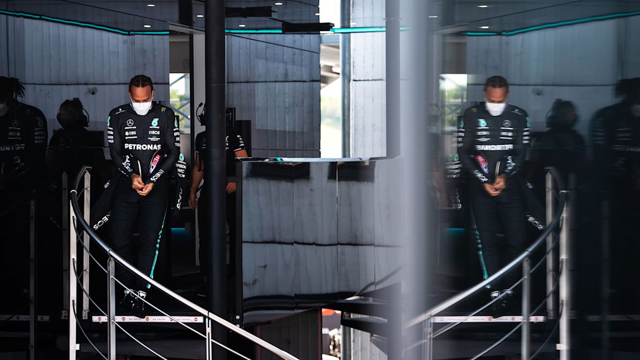 BUDAPEST, HUNGARY - JULY 30: Lewis Hamilton of Great Britain and Mercedes GP walks in the Paddock during practice ahead of the F1 Grand Prix of Hungary at Hungaroring on July 30, 2021 in Budapest, Hungary. (Photo by Rudy Carezzevoli - Formula 1/Formula 1 via Getty Images)