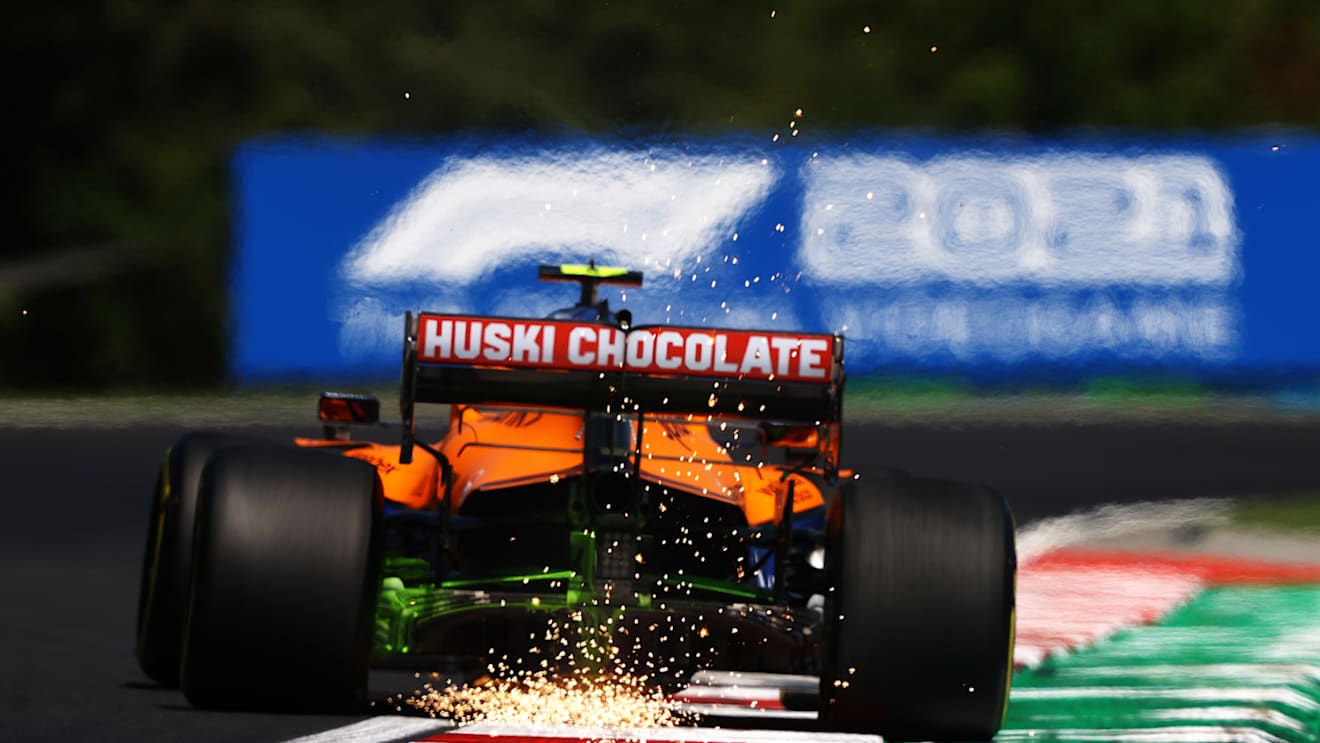 BUDAPEST, HUNGARY - JULY 30: Sparks fly behind Lando Norris of Great Britain driving the (4) McLaren F1 Team MCL35M Mercedes during practice ahead of the F1 Grand Prix of Hungary at Hungaroring on July 30, 2021 in Budapest, Hungary. (Photo by Bryn Lennon/Getty Images)