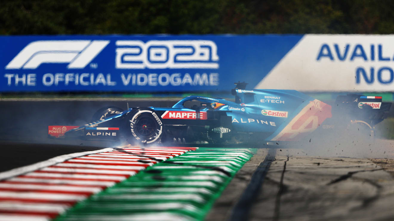 BUDAPEST, HUNGARY - JULY 30: Fernando Alonso of Spain driving the (14) Alpine A521 Renault spins during practice ahead of the F1 Grand Prix of Hungary at Hungaroring on July 30, 2021 in Budapest, Hungary. (Photo by Bryn Lennon/Getty Images)