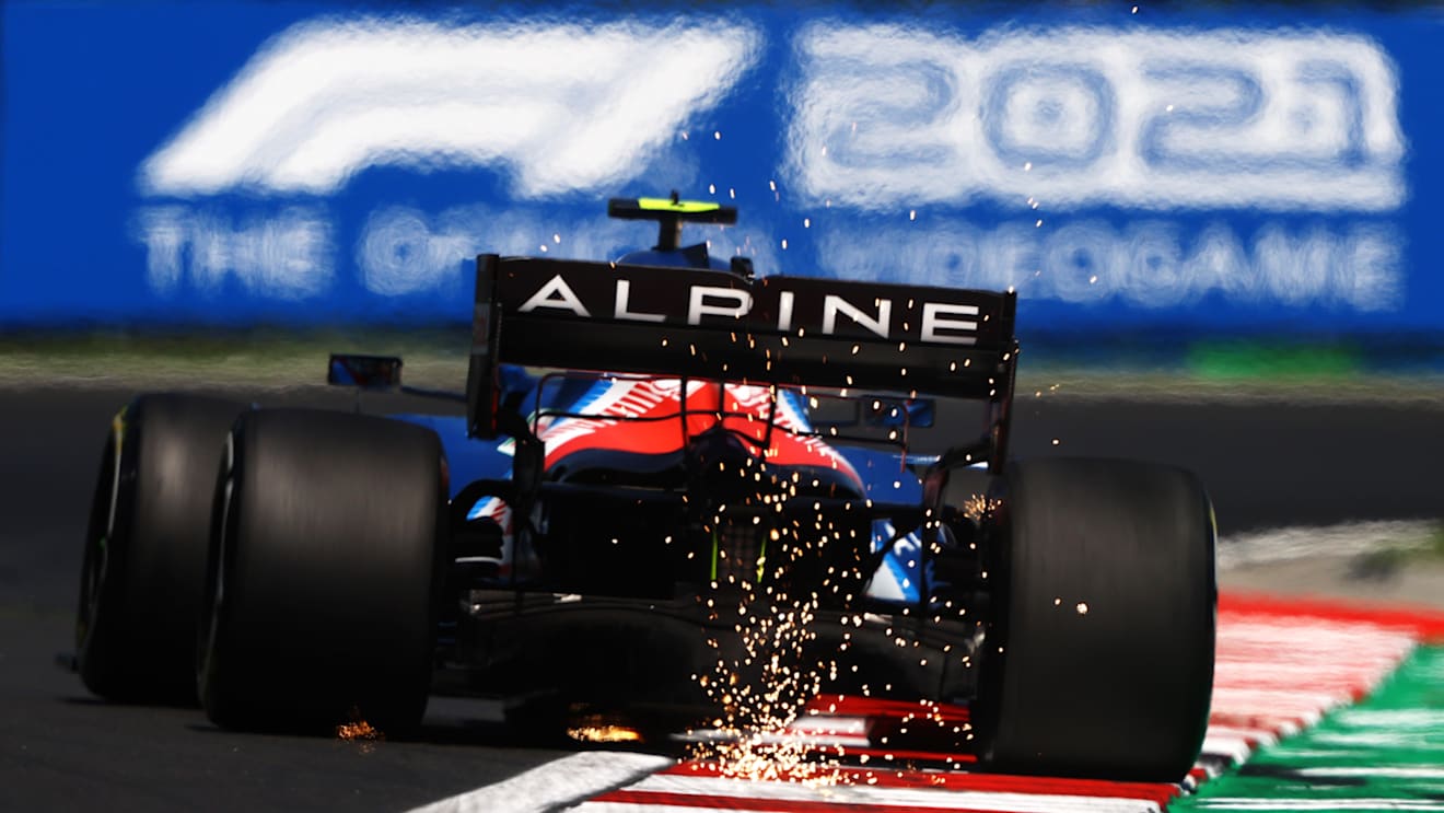 BUDAPEST, HUNGARY - JULY 30: Sparks fly behind Esteban Ocon of France driving the (31) Alpine A521 Renault during practice ahead of the F1 Grand Prix of Hungary at Hungaroring on July 30, 2021 in Budapest, Hungary. (Photo by Bryn Lennon/Getty Images)